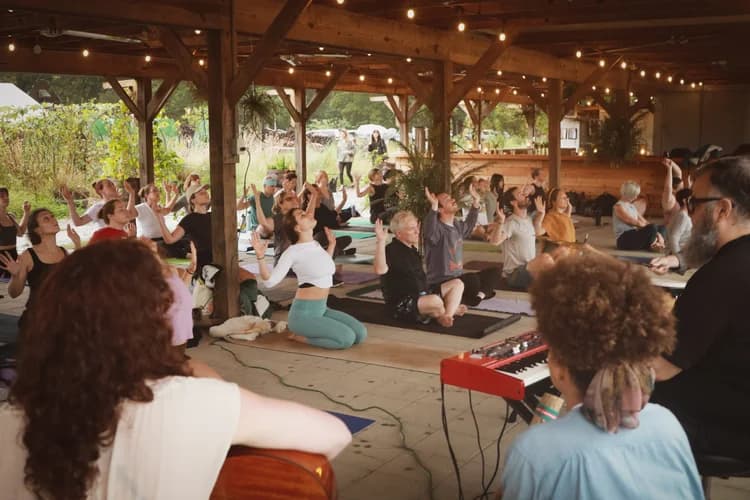 A sound bath gathering inside the barn sanctuary