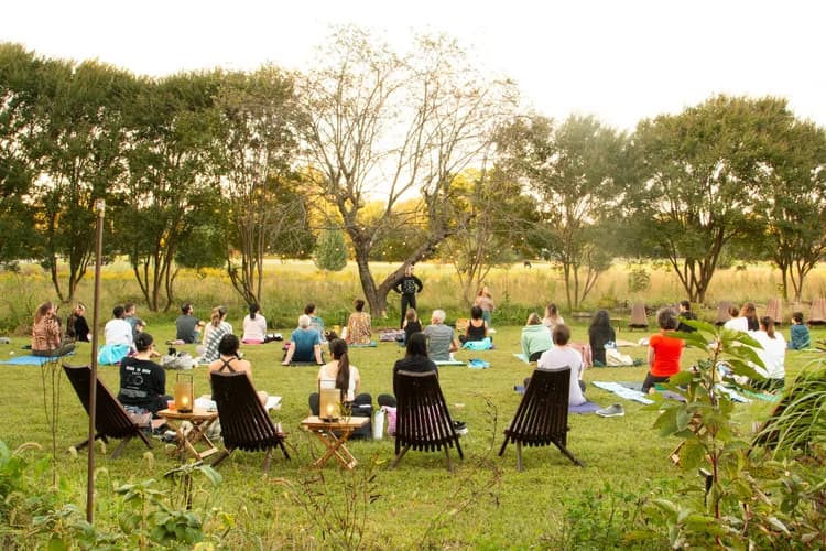 Outdoor yoga circle at dusk in the wildflower meadow